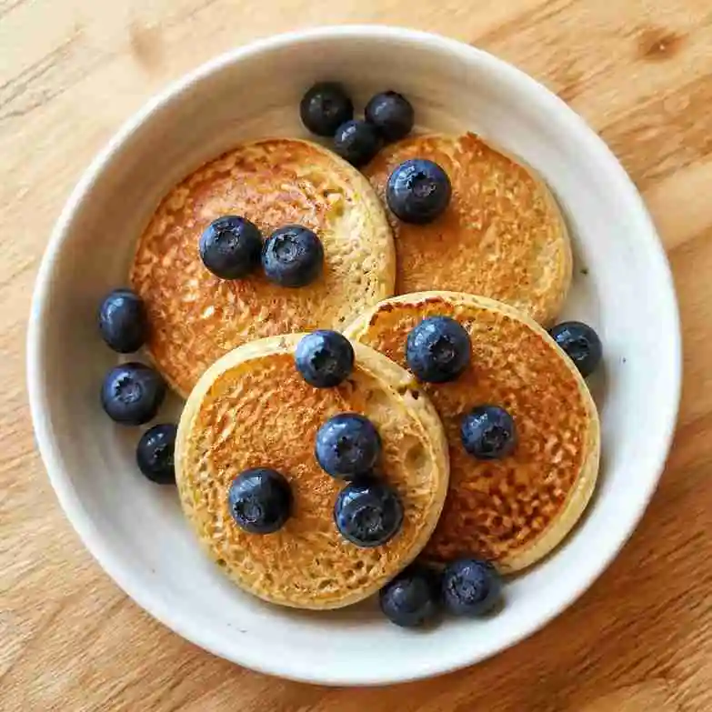 Healthy Breakfast Ideas for 1 Year Old: 50+ Easy & Nutritious Recipes 3 Healthy breakfast for 1 year old toddler, banana oat pancakes with fresh blueberries