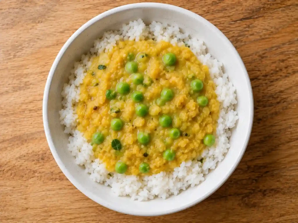 2 Year Old Meal Plan: A Complete 7-Day Guide for Busy Parents 3 dal chawal yellow lentil soup over white rice with soft green peas